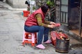 CANTON, CHINA Ã¢â¬â CIRCA FEBRUARY 2018: A woman offers a sacrifice during the Chinese New Year.